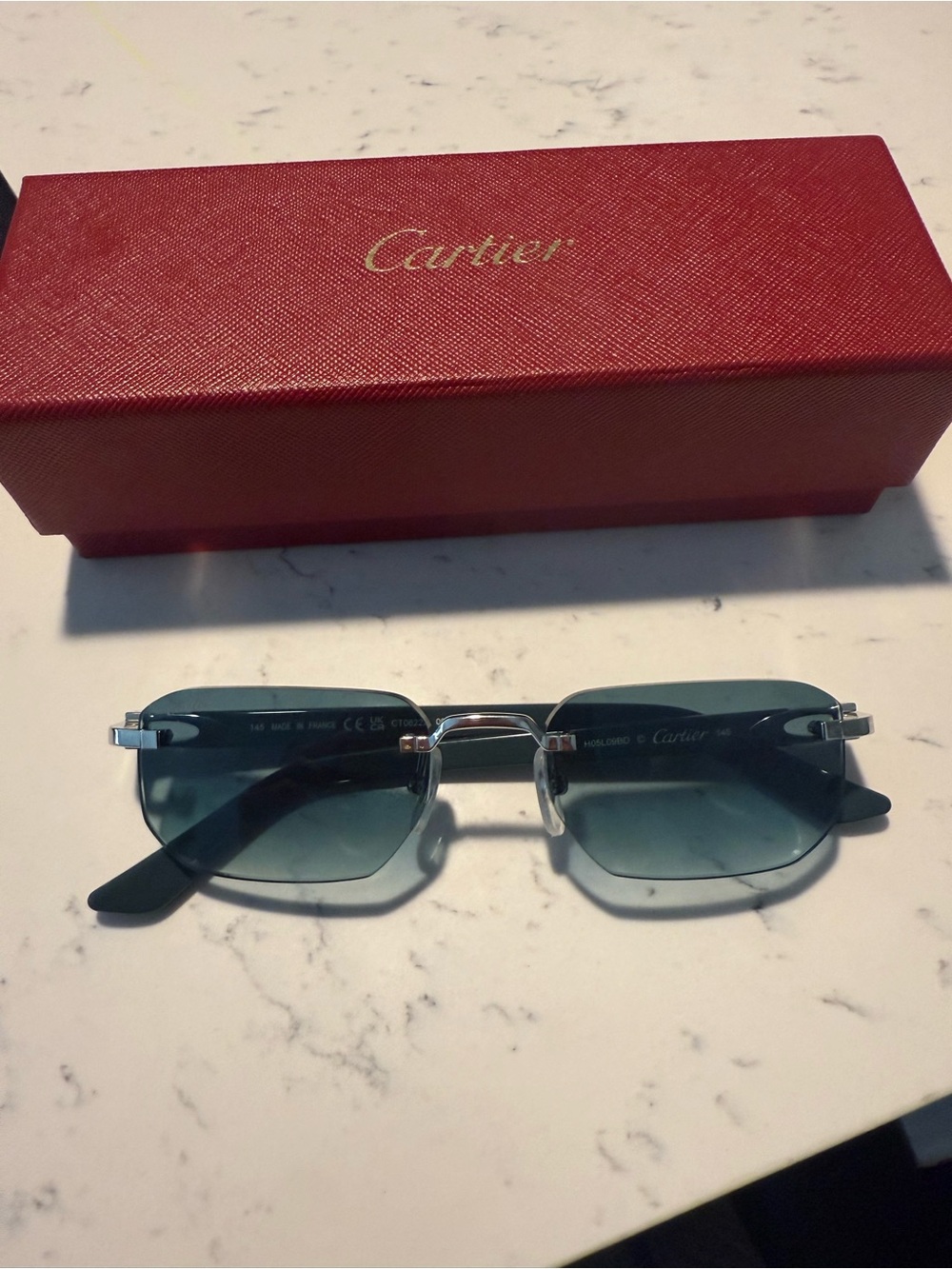 Cartier Rimless Sunglasses with Teal Lenses and Silver Hardware